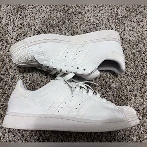 White Adidas Superstar sneakers